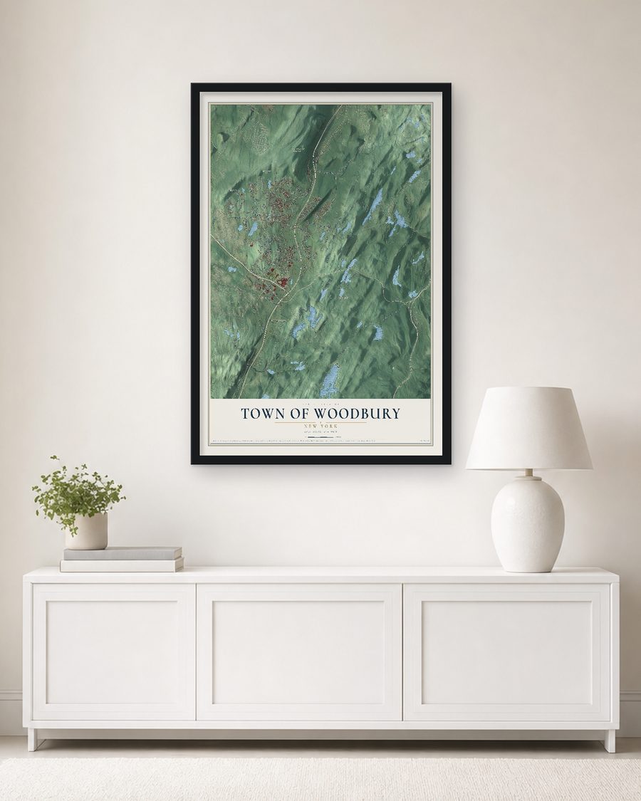 The Town of Woodbury, New York map, 24 x 36 in, in a black wood frame on a living room wall