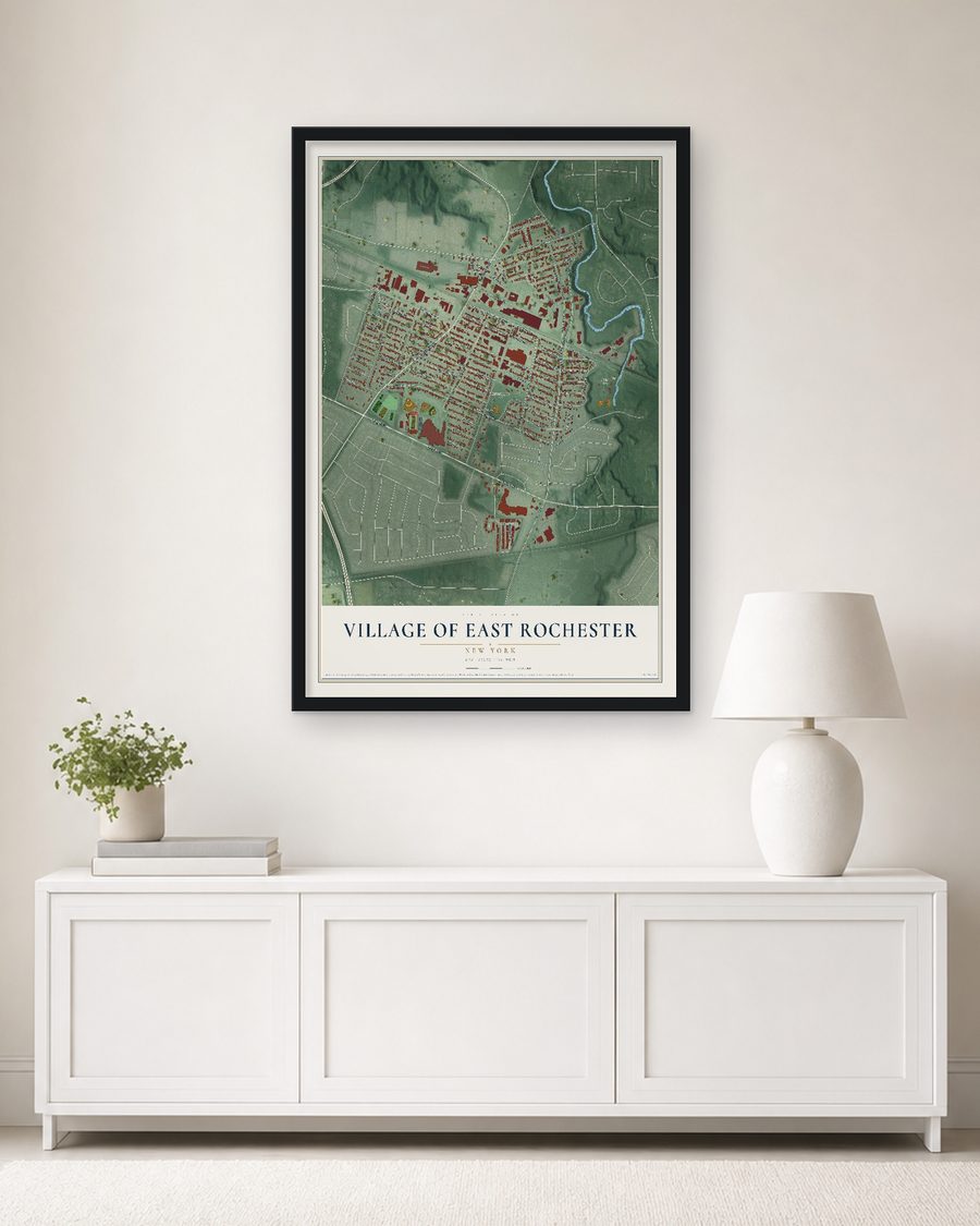 The Village of East Rochester, New York map, 24 x 36 in, in a black wood frame on a living room wall