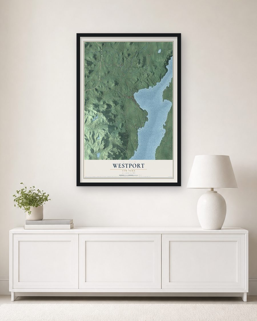 The Westport, New York map, 24 x 36 in, in a black wood frame on a living room wall