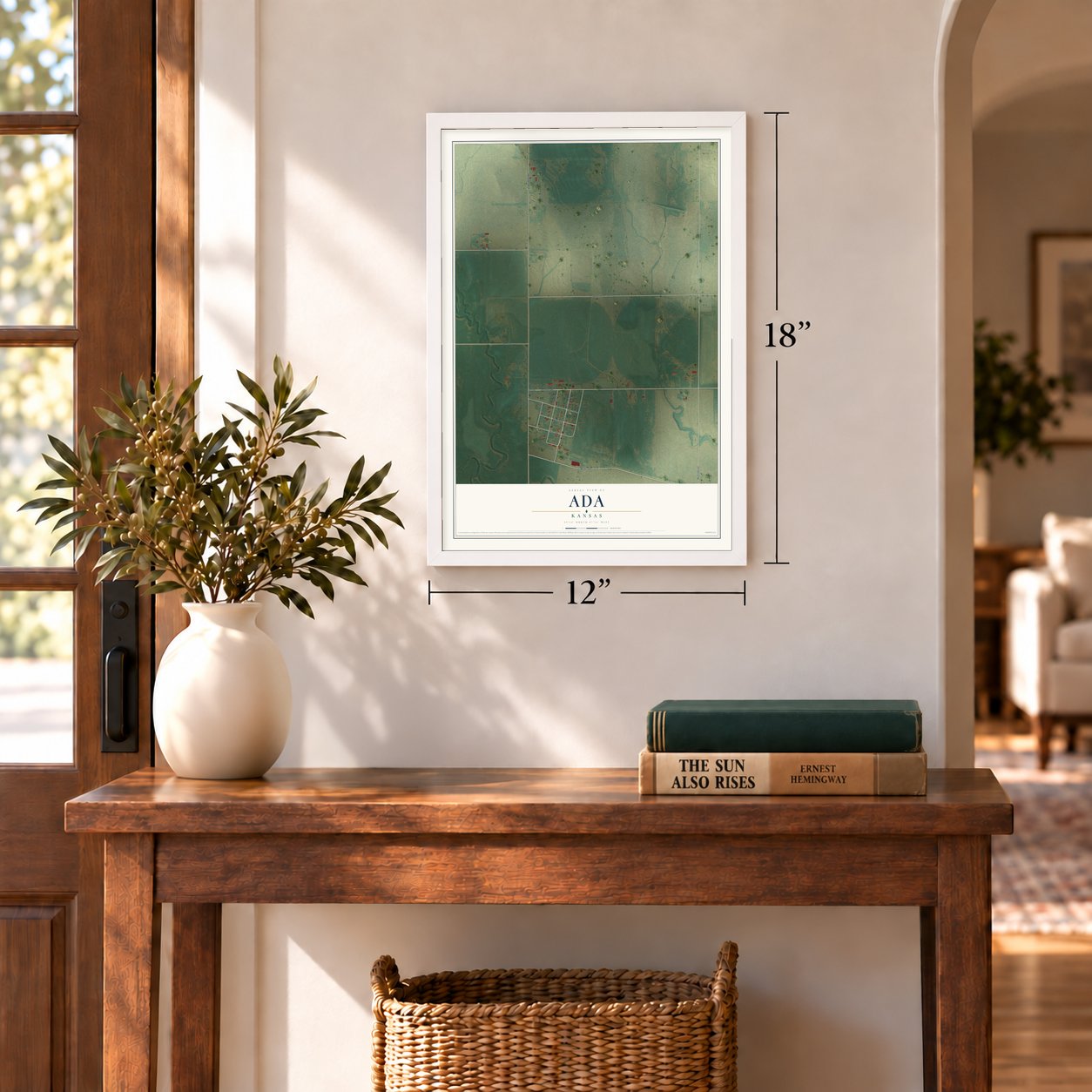 Ada, Kansas map, 12 x 18 inch print in a white frame in an entryway
