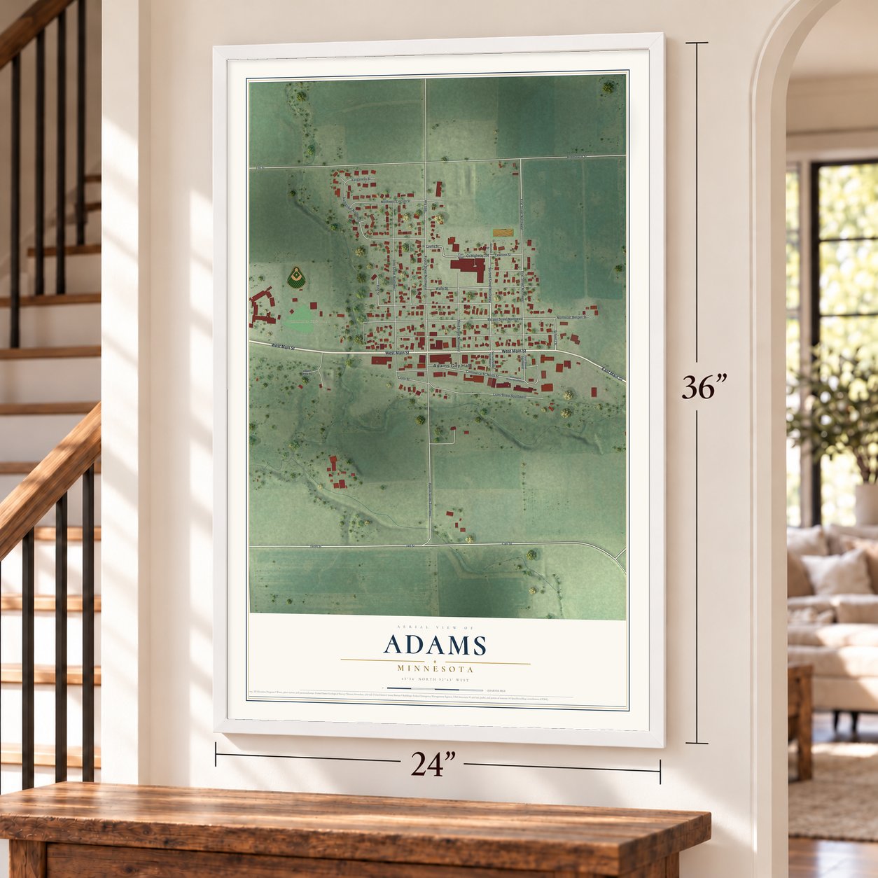 Adams, Minnesota map, 24 x 36 inch print in a white frame by a staircase