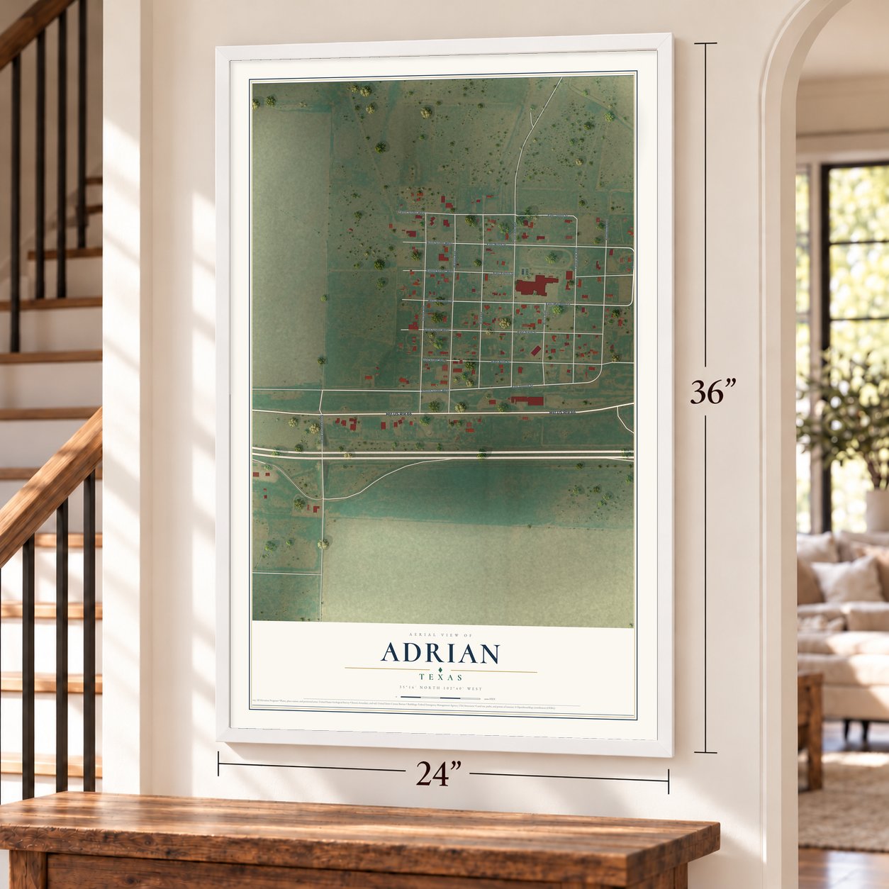 Adrian, Texas map, 24 x 36 inch print in a white frame by a staircase
