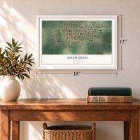 Ainsworth, Nebraska map, 12 x 18 inch print in a white frame in an entryway