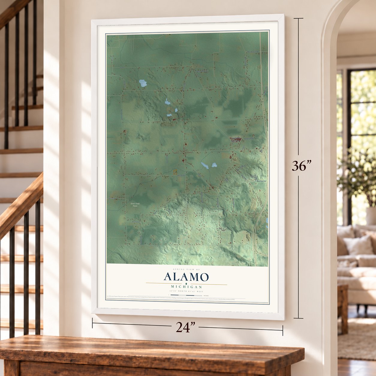Alamo, Michigan map, 24 x 36 inch print in a white frame by a staircase