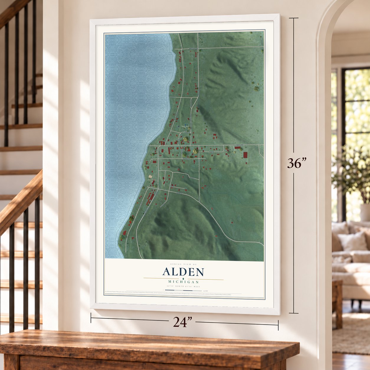 Alden, Michigan map, 24 x 36 inch print in a white frame by a staircase