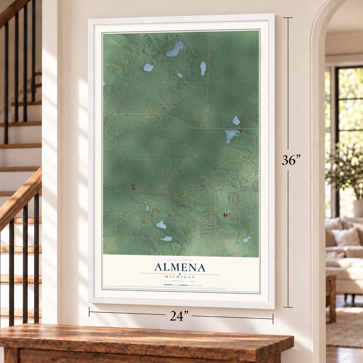 Almena, Michigan map, 24 x 36 inch print in a white frame by a staircase