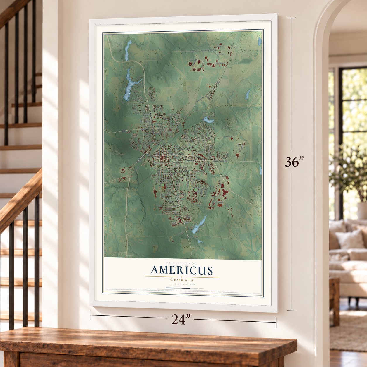 Americus, Georgia map, 24 x 36 inch print in a white frame by a staircase