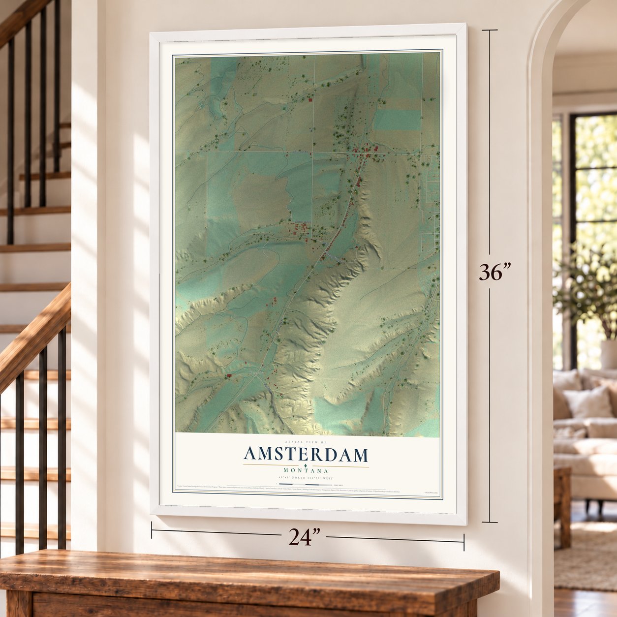 Amsterdam, Montana map, 24 x 36 inch print in a white frame by a staircase