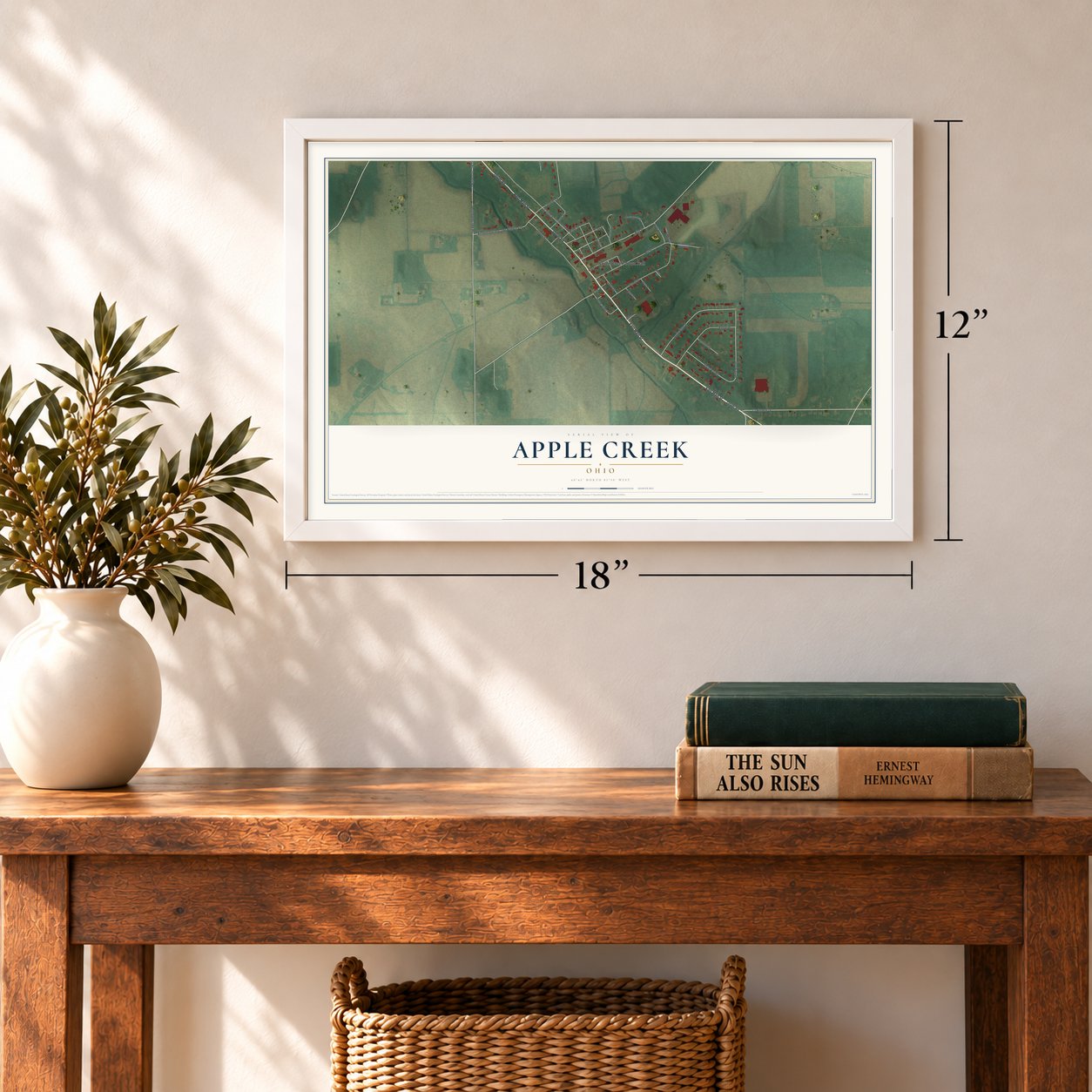 Apple Creek, Ohio map, 12 x 18 inch print in a white frame in an entryway