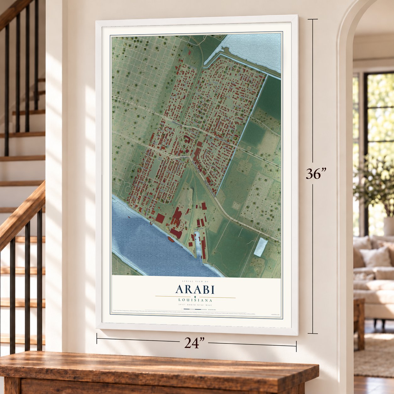 Arabi, Louisiana map, 24 x 36 inch print in a white frame by a staircase