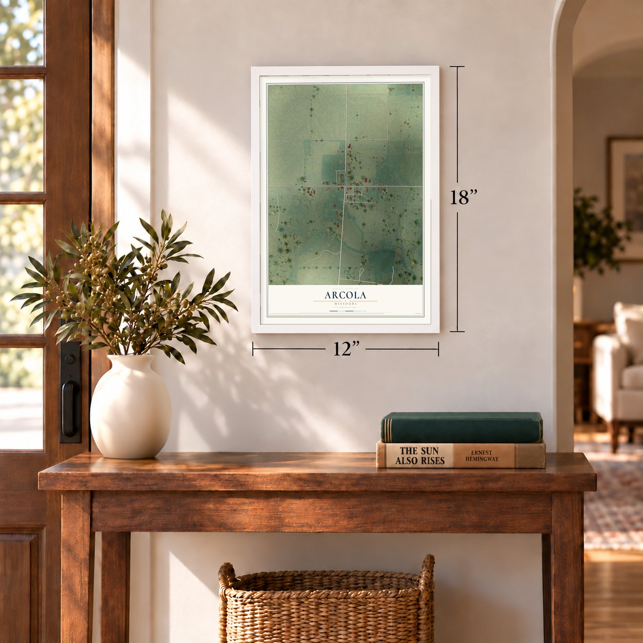 Arcola, Missouri map, 12 x 18 inch print in a white frame in an entryway