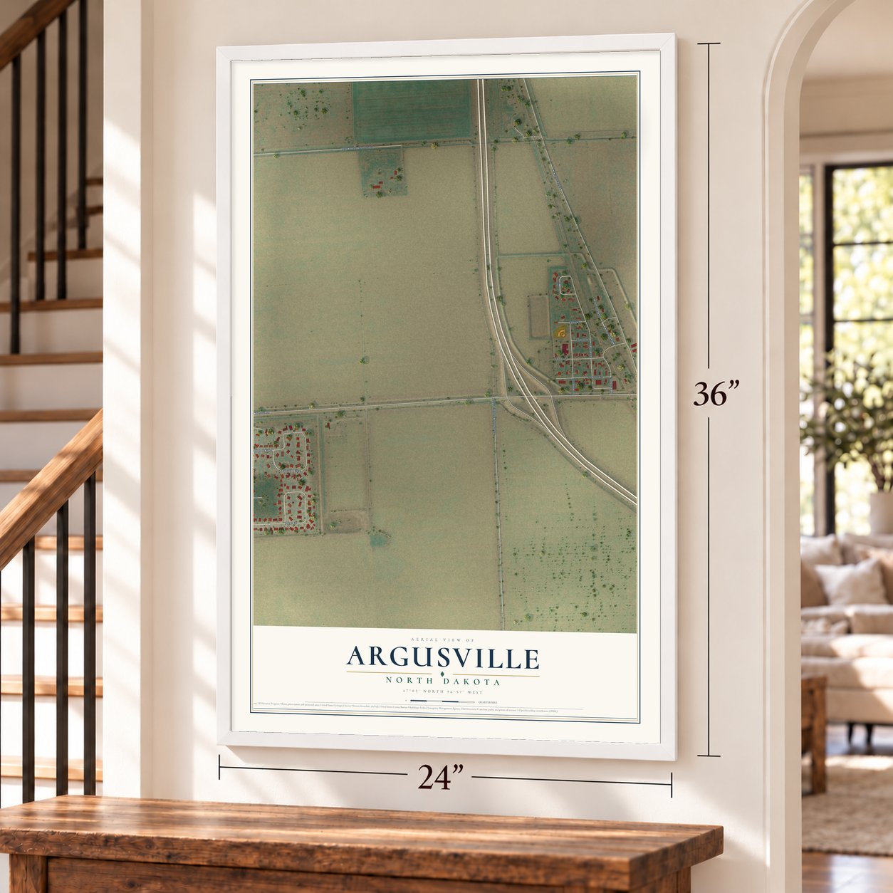 Argusville, North Dakota map, 24 x 36 inch print in a white frame by a staircase