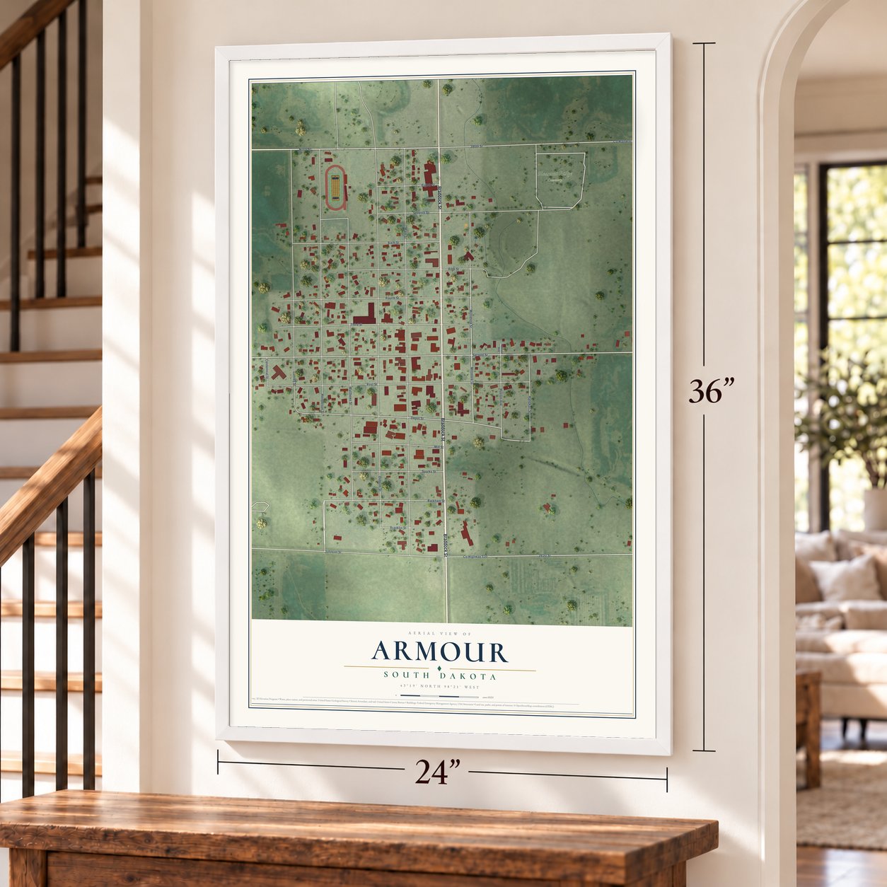 Armour, South Dakota map, 24 x 36 inch print in a white frame by a staircase