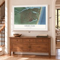 Asbury Park, New Jersey map, 24 x 36 inch print in a white frame above a dresser by a staircase