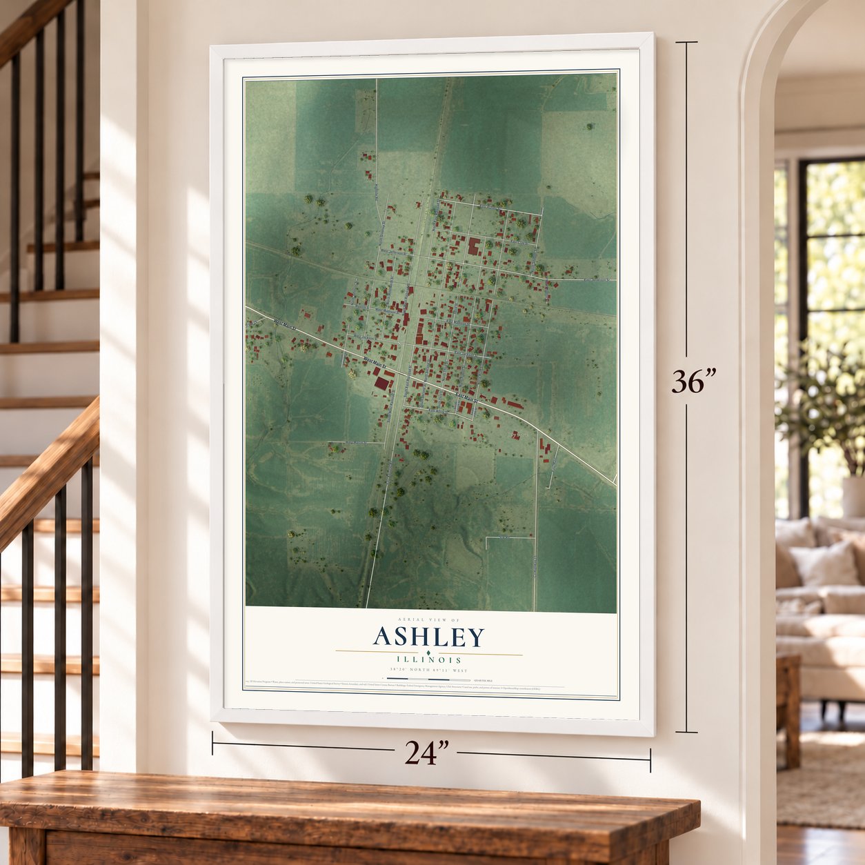 Ashley, Illinois map, 24 x 36 inch print in a white frame by a staircase