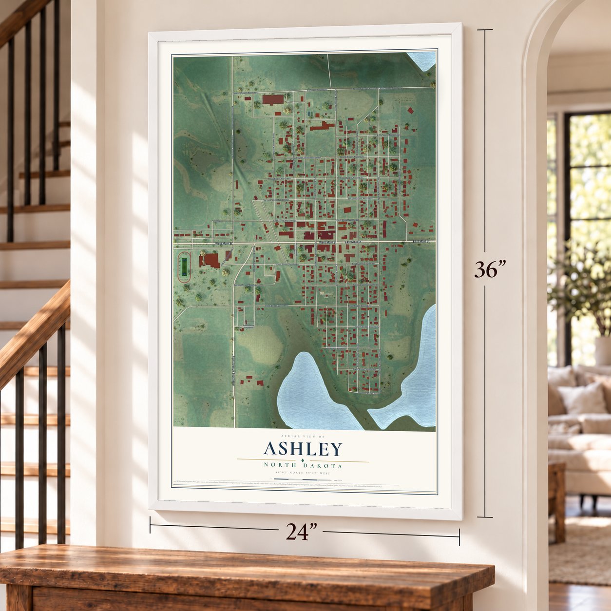 Ashley, North Dakota map, 24 x 36 inch print in a white frame by a staircase