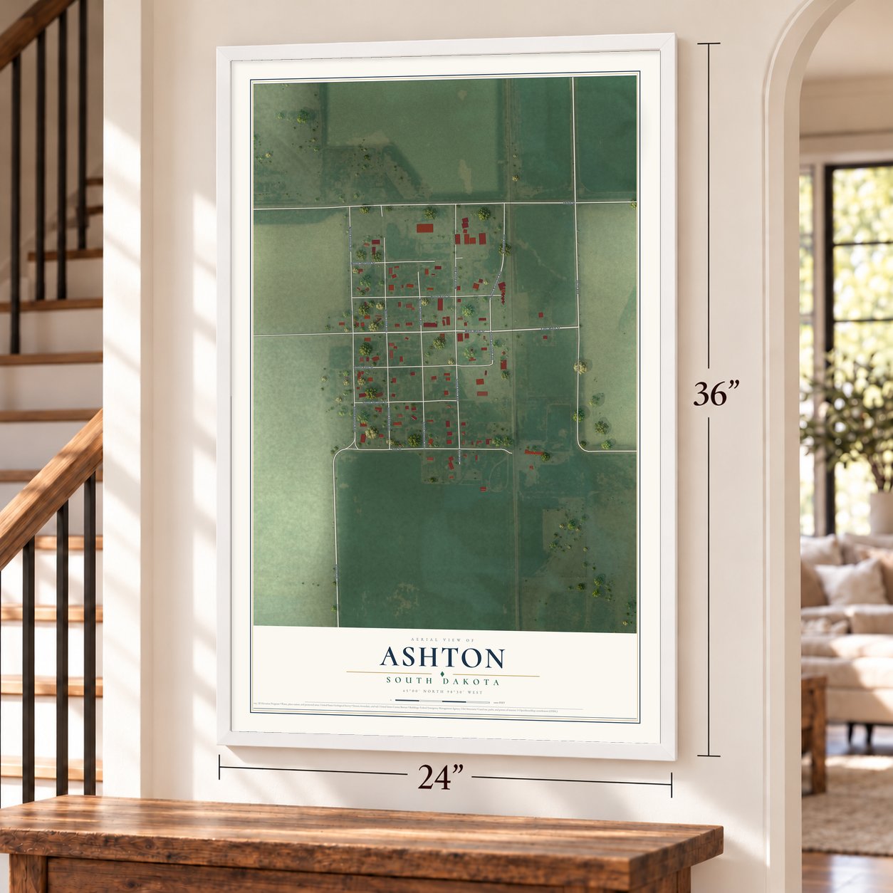 Ashton, South Dakota map, 24 x 36 inch print in a white frame by a staircase