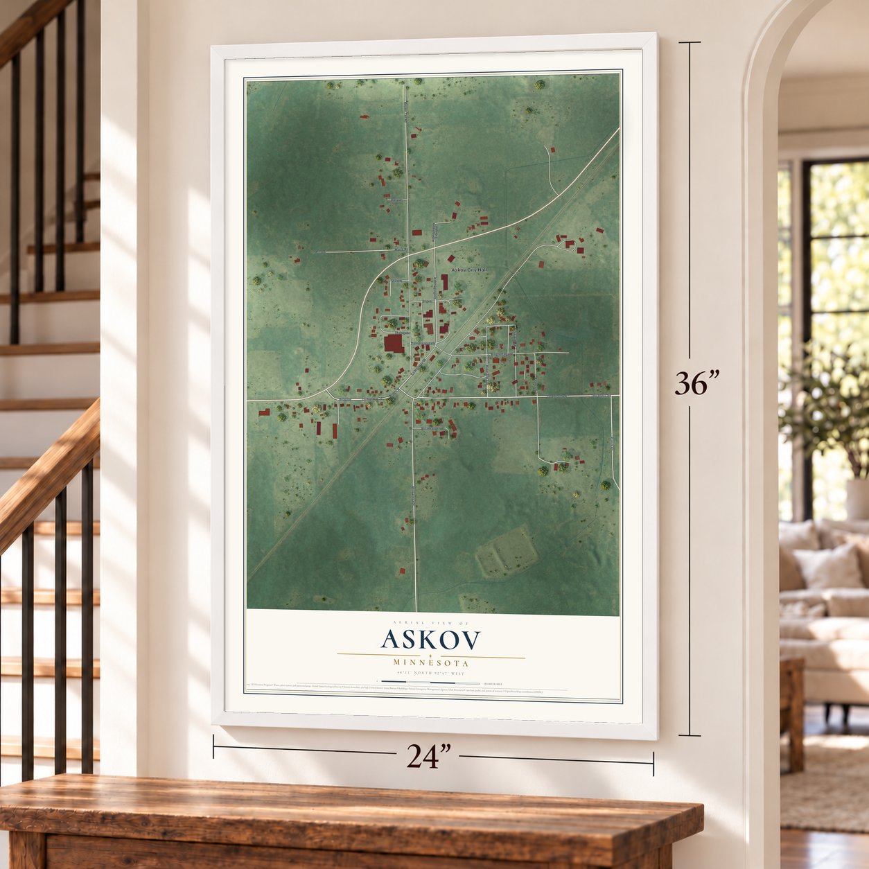 Askov, Minnesota map, 24 x 36 inch print in a white frame by a staircase