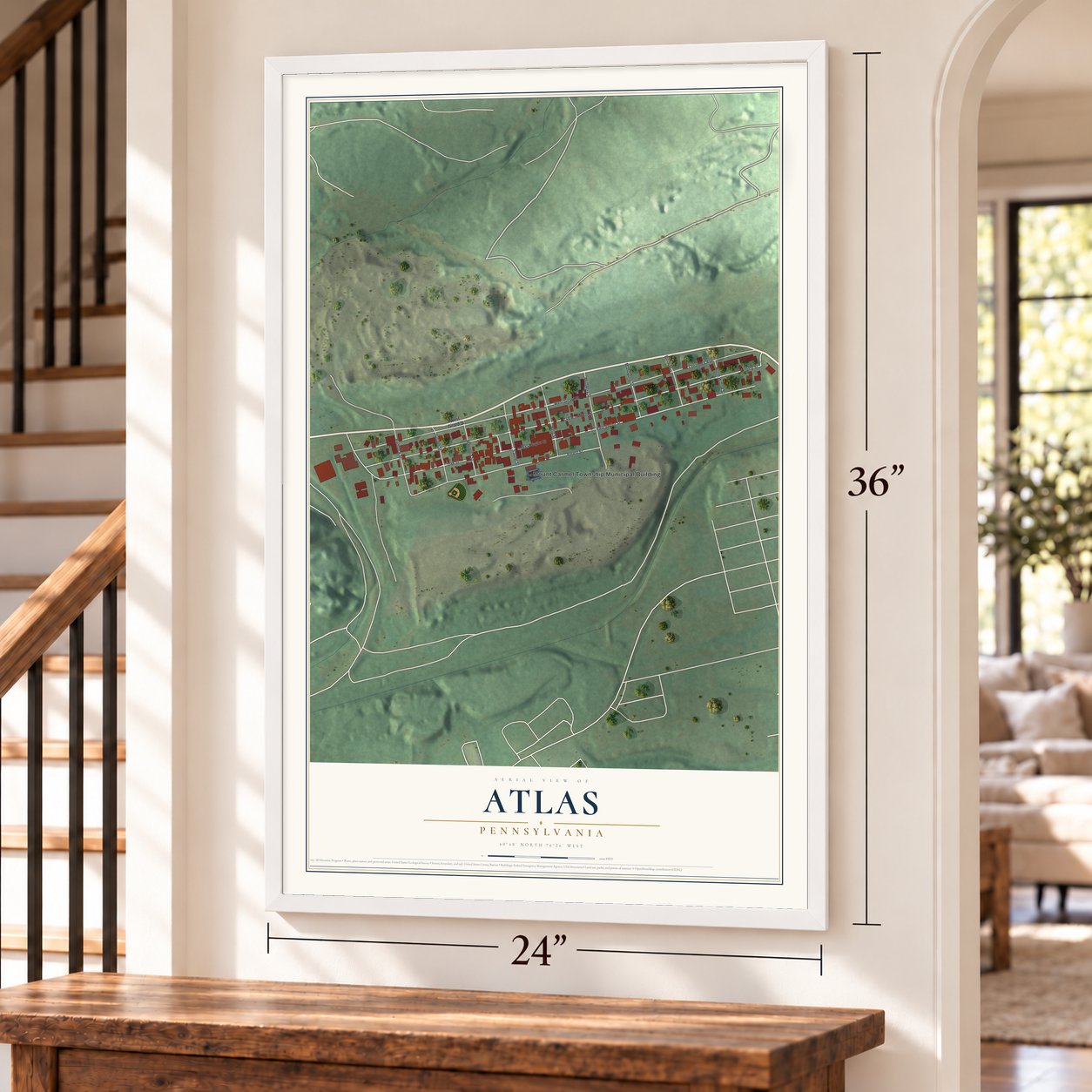 Atlas, Pennsylvania map, 24 x 36 inch print in a white frame by a staircase