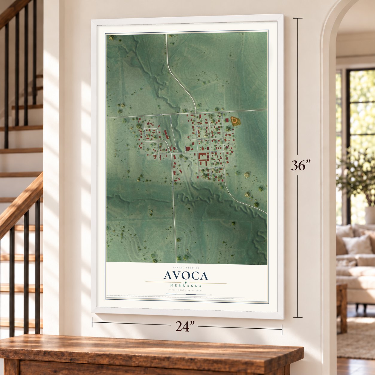 Avoca, Nebraska map, 24 x 36 inch print in a white frame by a staircase