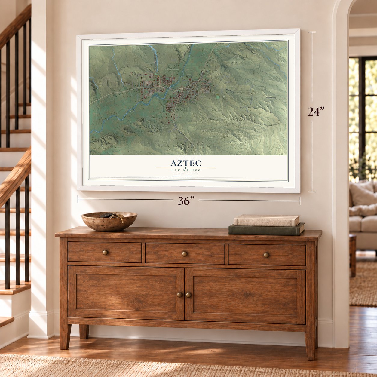 Aztec, New Mexico map, 24 x 36 inch print in a white frame above a dresser by a staircase