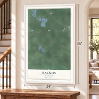 Backus, Michigan map, 24 x 36 inch print in a white frame by a staircase