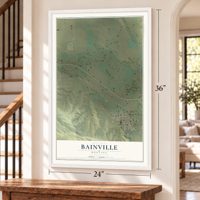 Bainville, Montana map, 24 x 36 inch print in a white frame by a staircase