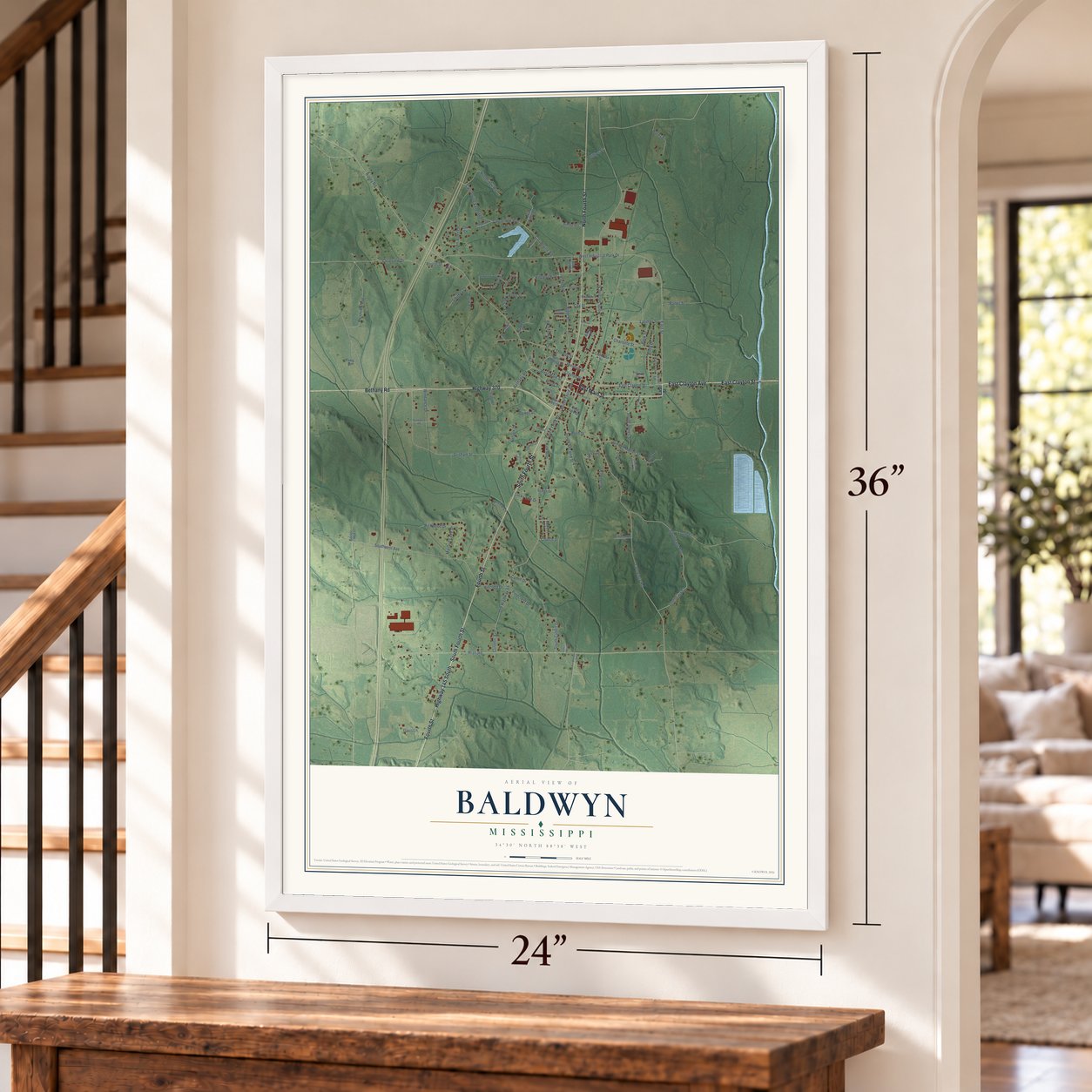 Baldwyn, Mississippi map, 24 x 36 inch print in a white frame by a staircase
