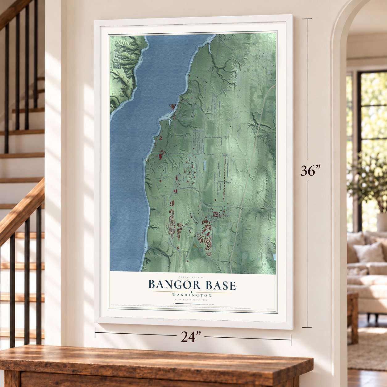 Bangor Base, Washington map, 24 x 36 inch print in a white frame by a staircase