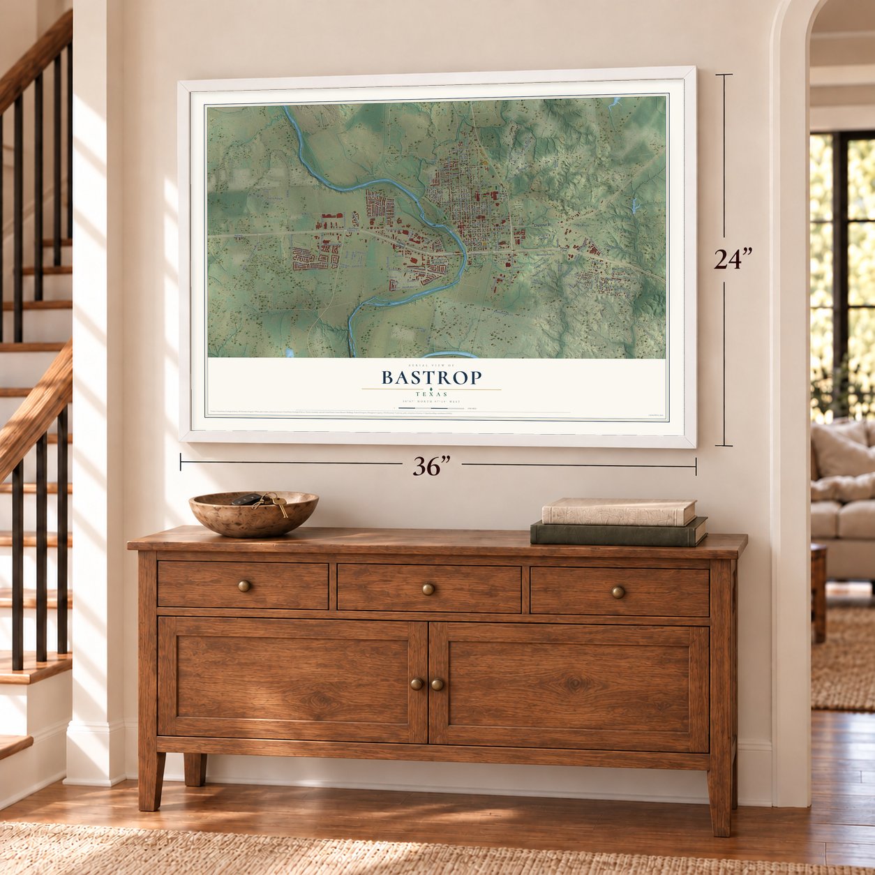 Bastrop, Texas map, 24 x 36 inch print in a white frame above a dresser by a staircase