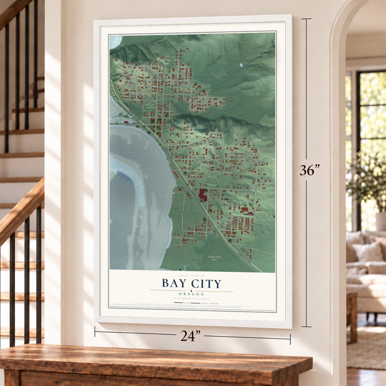 Bay City, Oregon map, 24 x 36 inch print in a white frame by a staircase