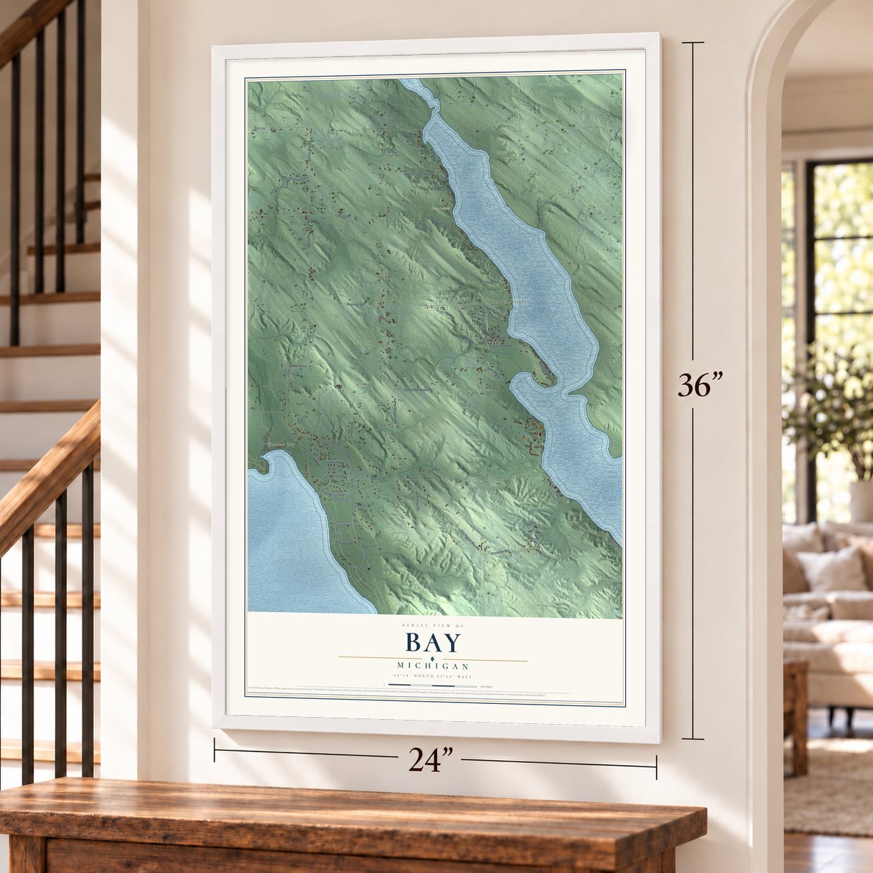 Bay, Michigan map, 24 x 36 inch print in a white frame by a staircase
