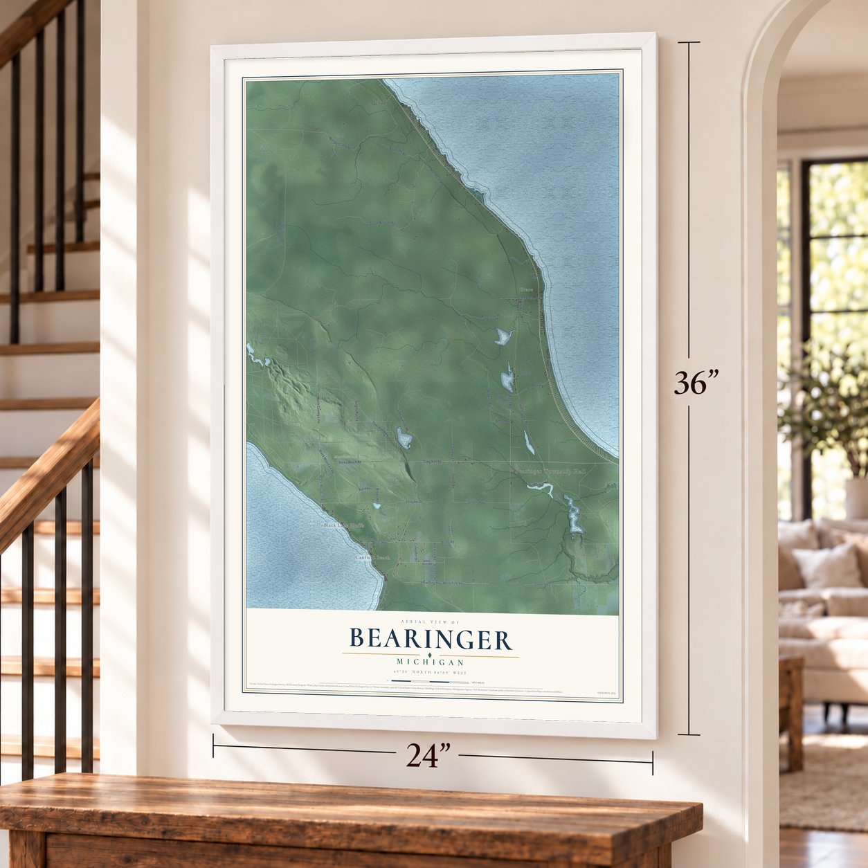 Bearinger, Michigan map, 24 x 36 inch print in a white frame by a staircase