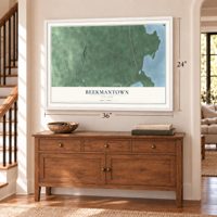 Beekmantown, New York map, 24 x 36 inch print in a white frame above a dresser by a staircase