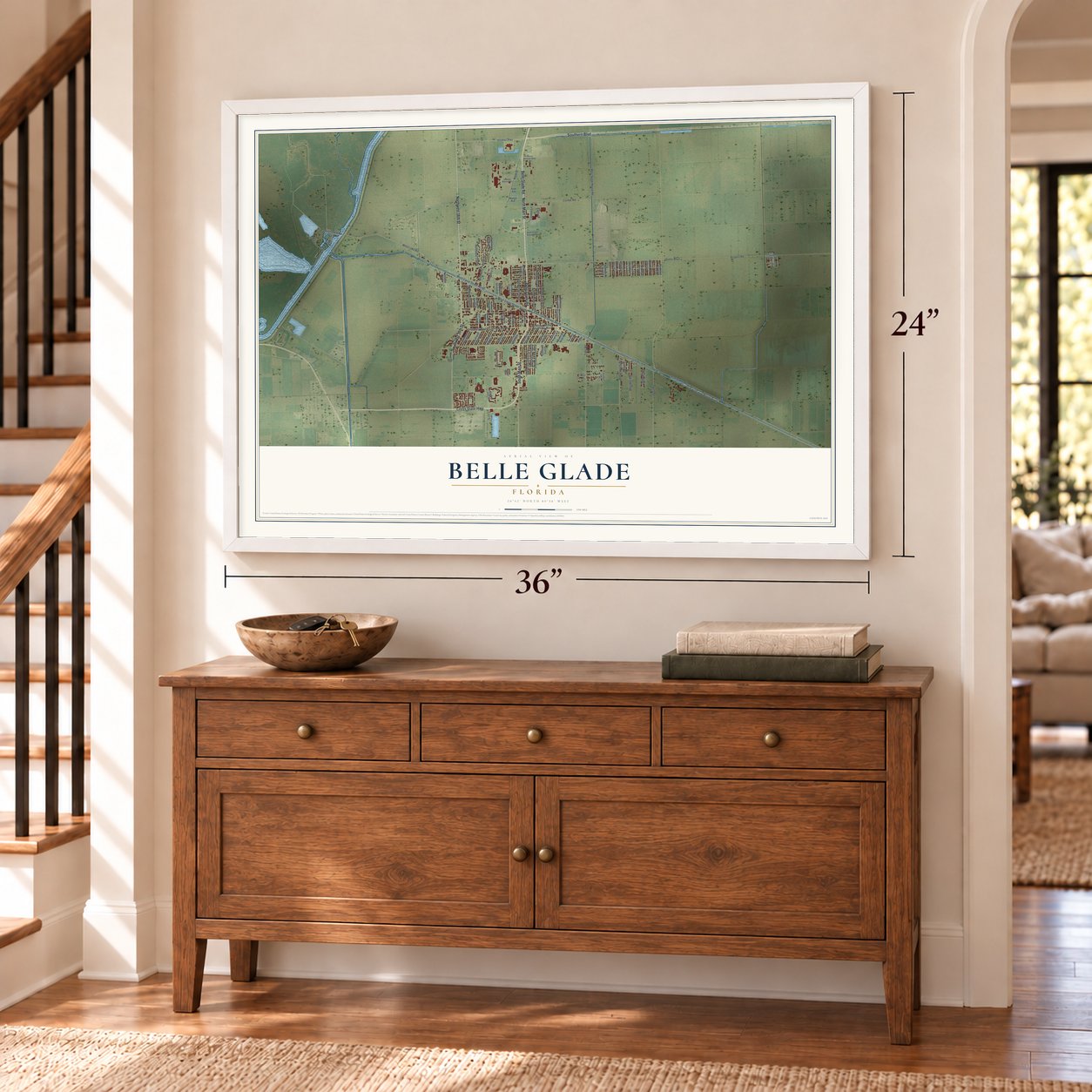 Belle Glade, Florida map, 24 x 36 inch print in a white frame above a dresser by a staircase
