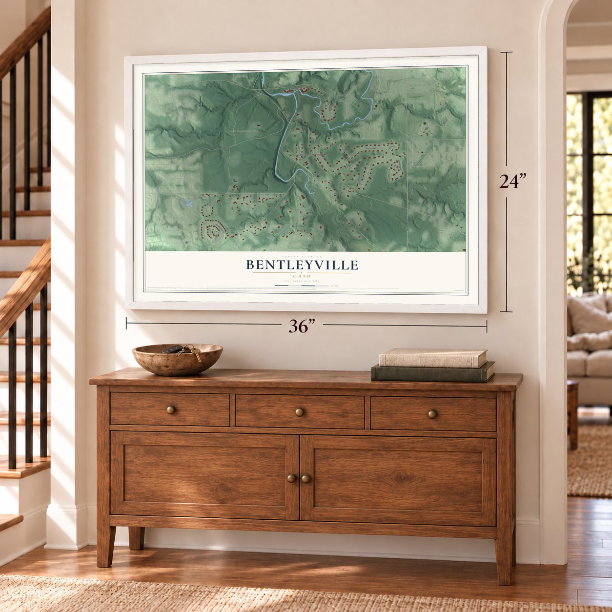 Bentleyville, Ohio map, 24 x 36 inch print in a white frame above a dresser by a staircase
