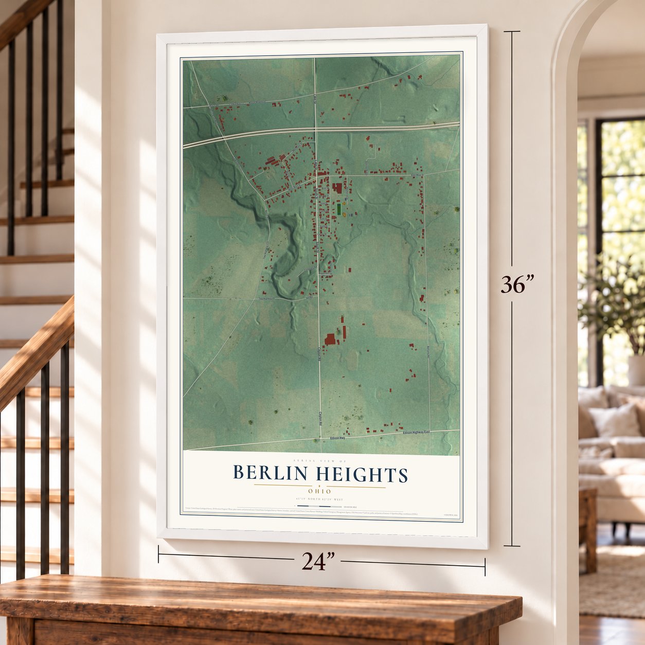 Berlin Heights, Ohio map, 24 x 36 inch print in a white frame by a staircase