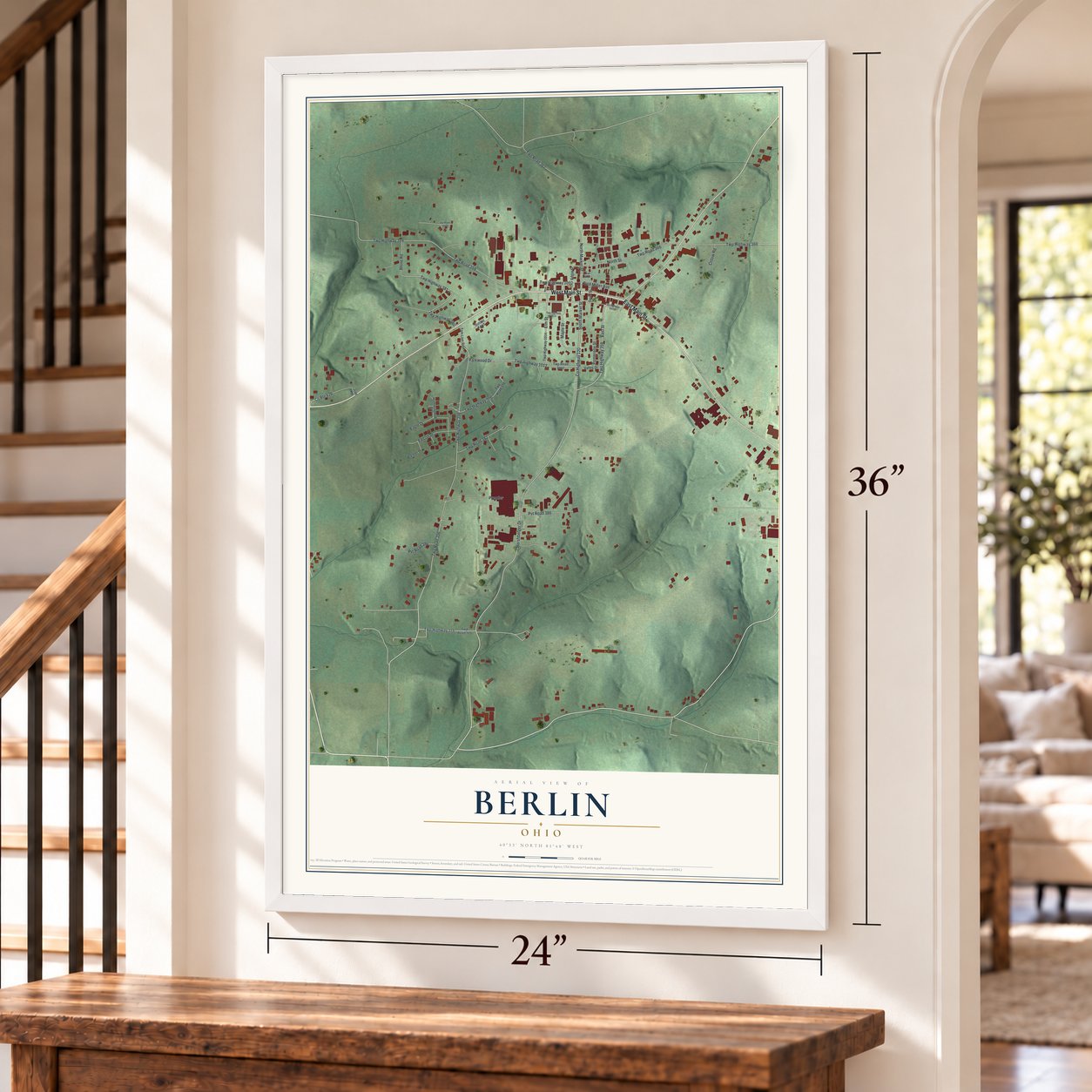 Berlin, Ohio map, 24 x 36 inch print in a white frame by a staircase
