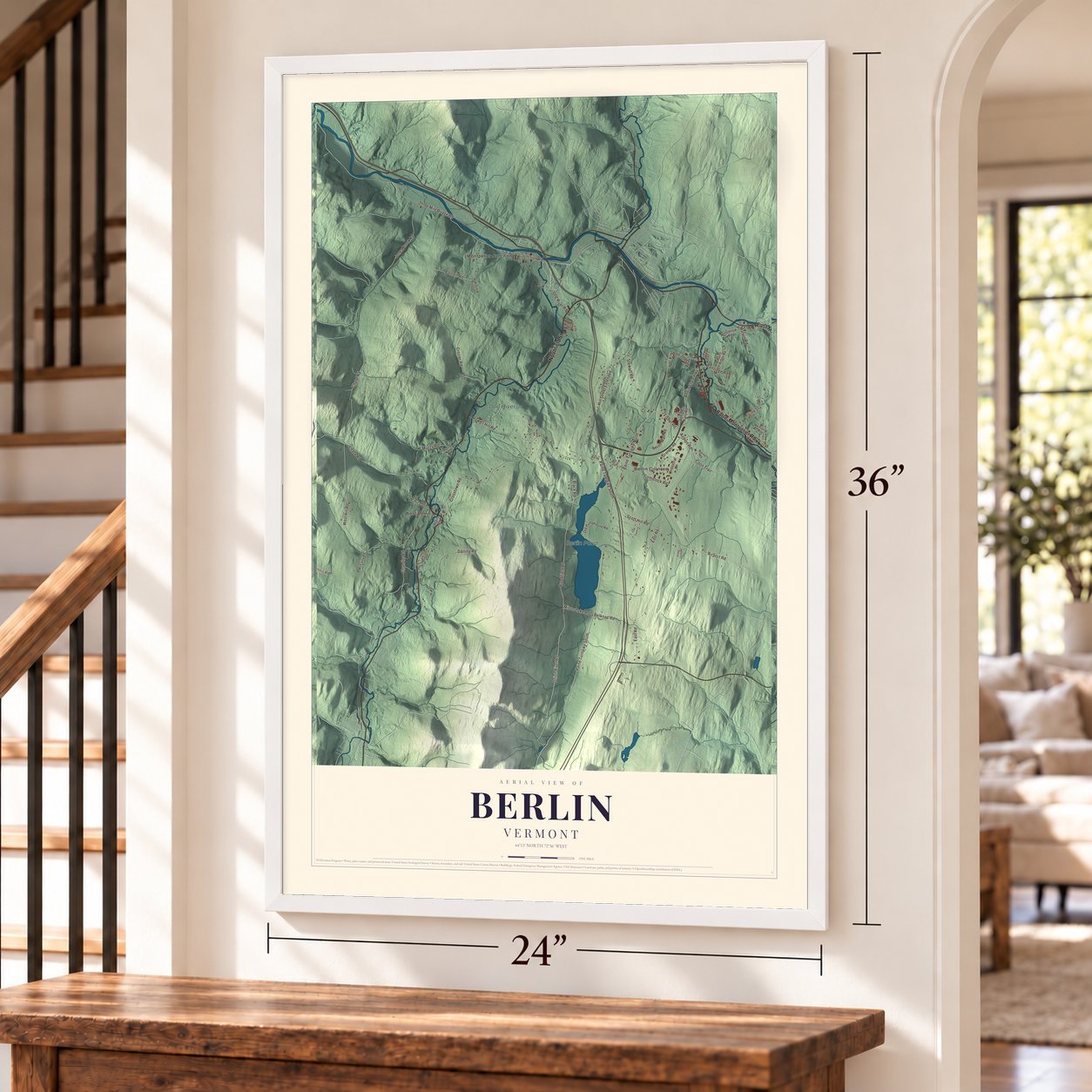 Berlin, Vermont map, 24 x 36 inch print in a white frame by a staircase