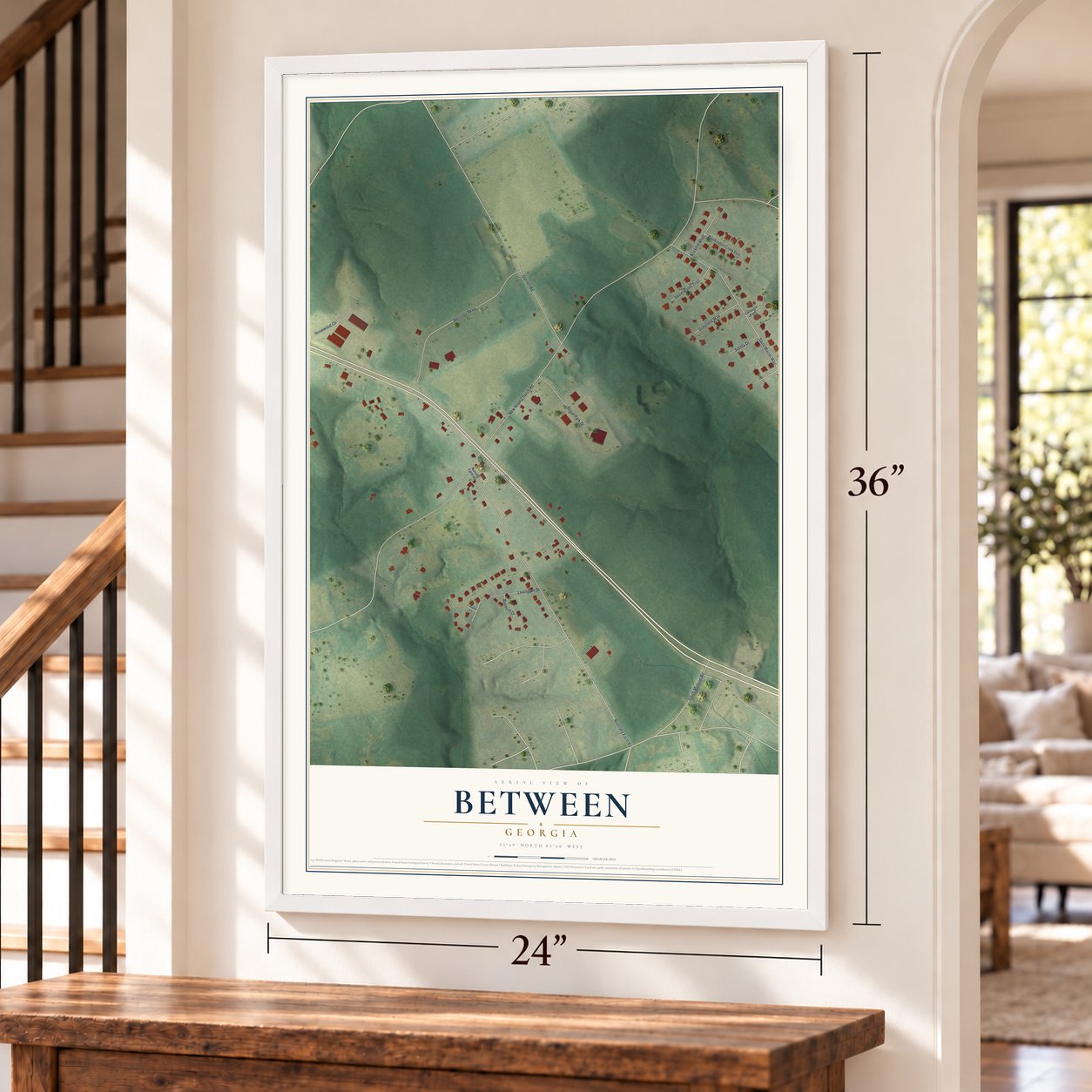 Between, Georgia map, 24 x 36 inch print in a white frame by a staircase
