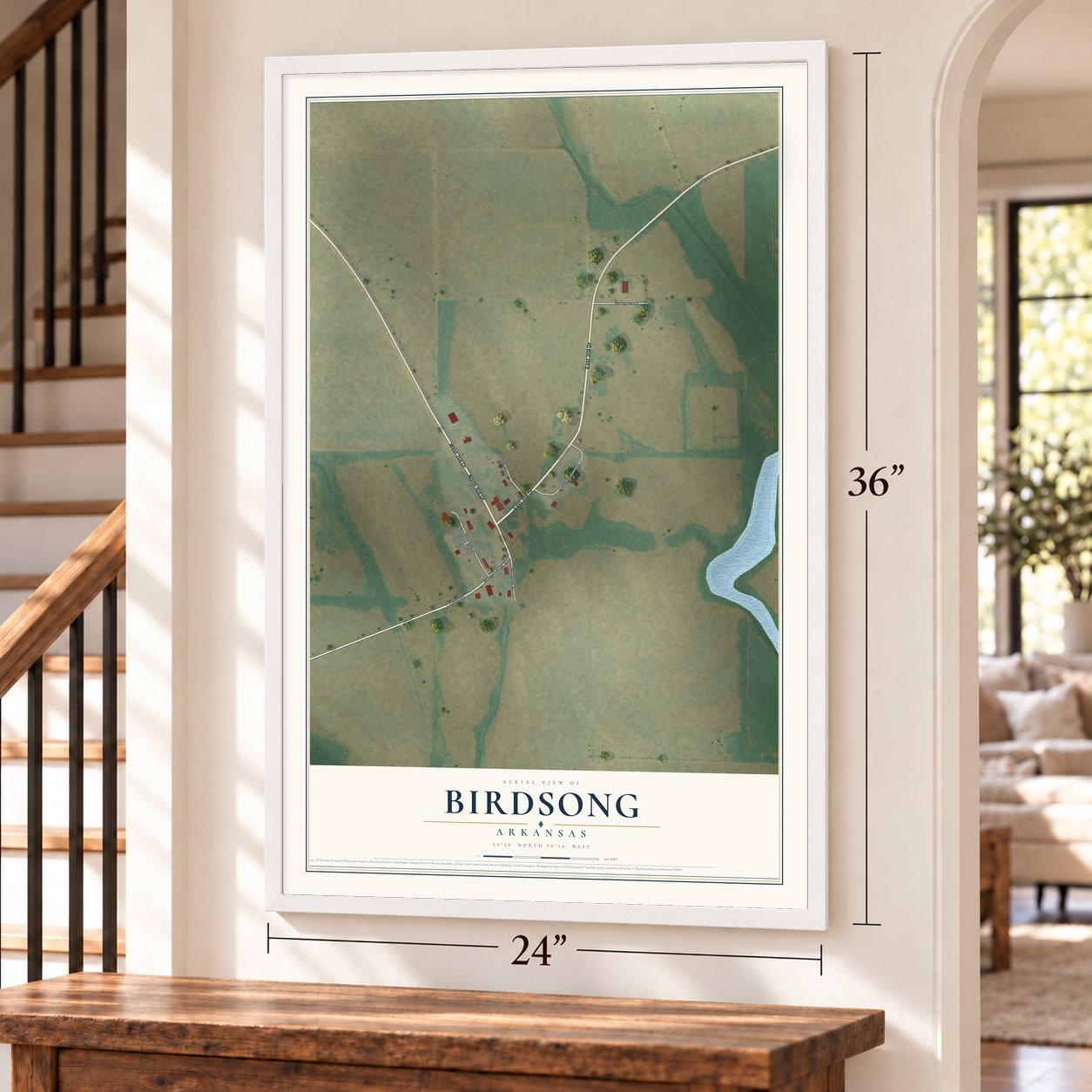 Birdsong, Arkansas map, 24 x 36 inch print in a white frame by a staircase