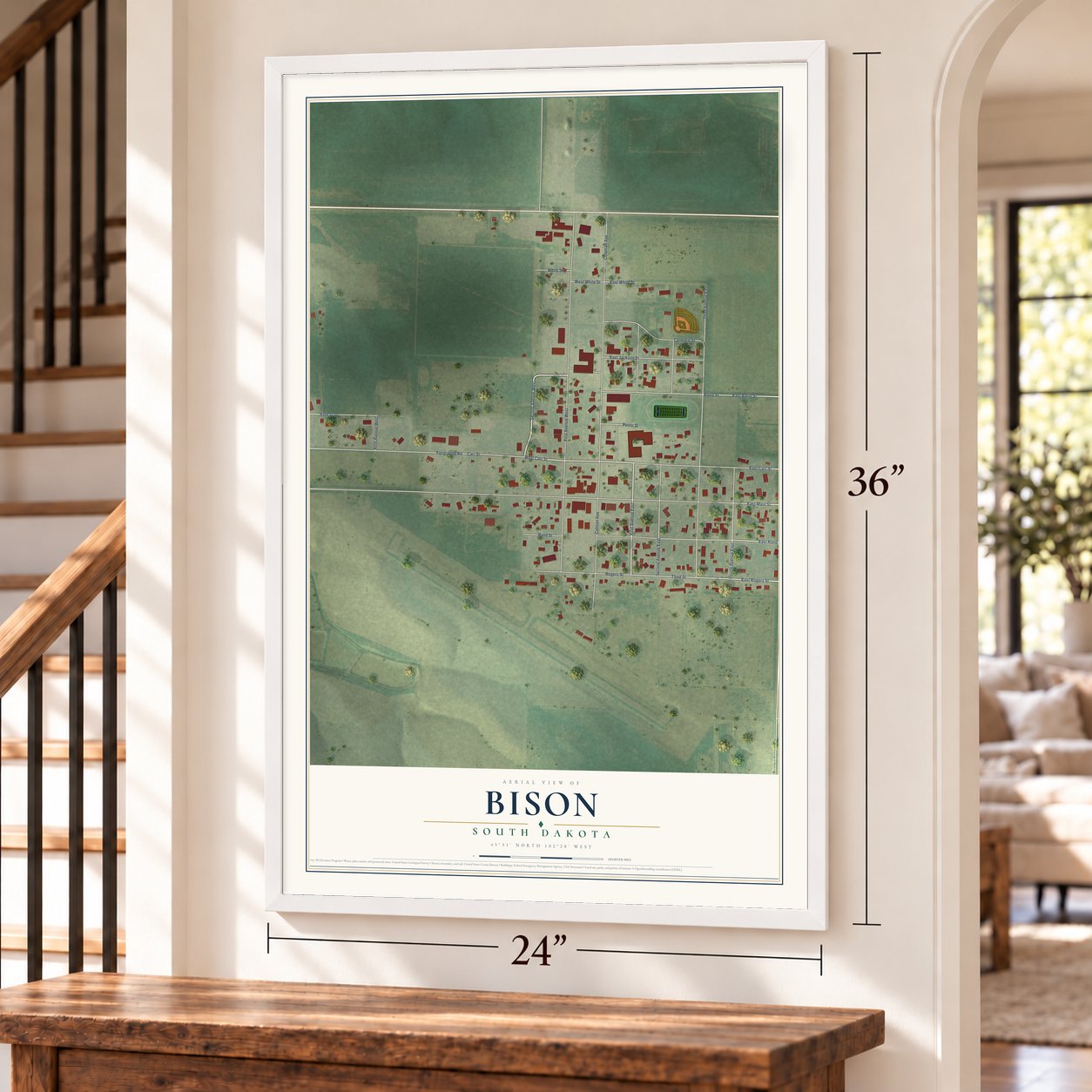 Bison, South Dakota map, 24 x 36 inch print in a white frame by a staircase