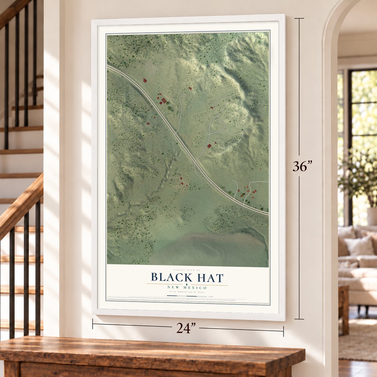 Black Hat, New Mexico map, 24 x 36 inch print in a white frame by a staircase