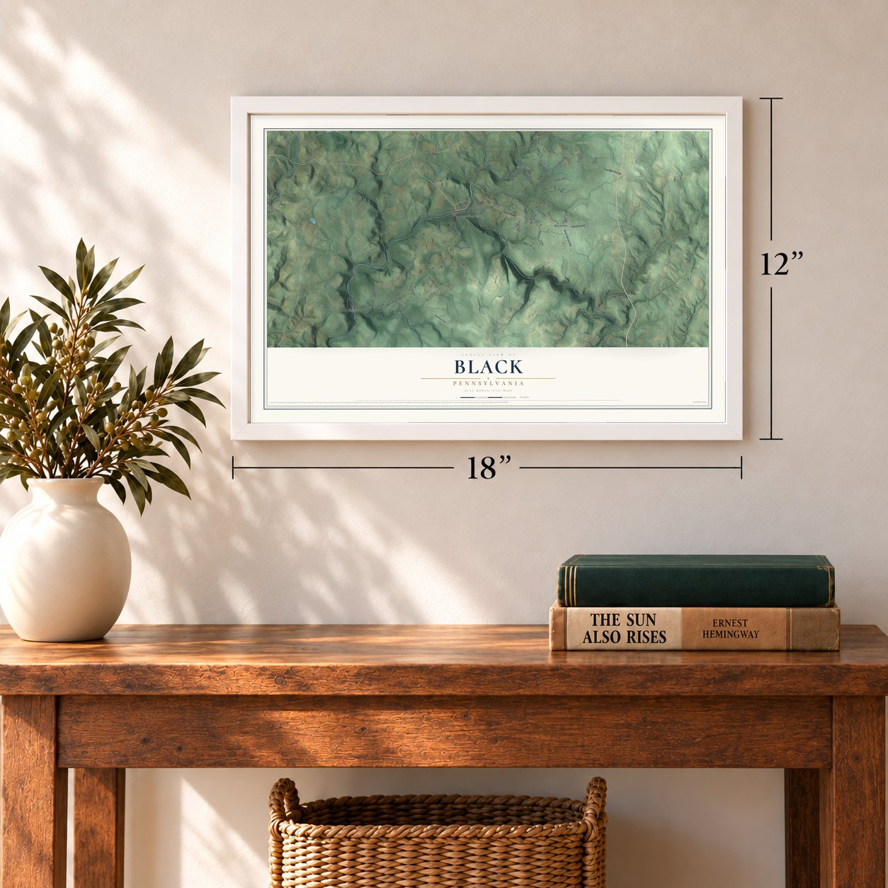Black, Pennsylvania map, 12 x 18 inch print in a white frame in an entryway