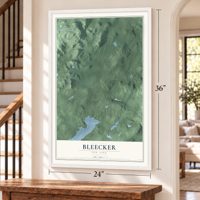 Bleecker, New York map, 24 x 36 inch print in a white frame by a staircase