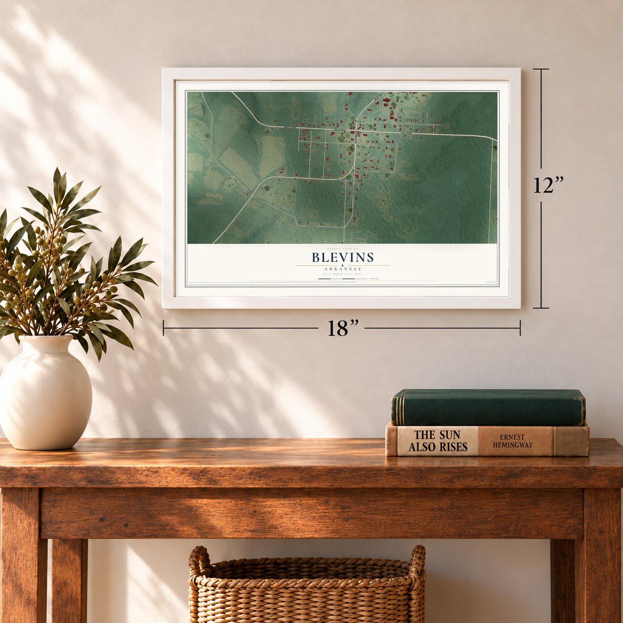 Blevins, Arkansas map, 12 x 18 inch print in a white frame in an entryway