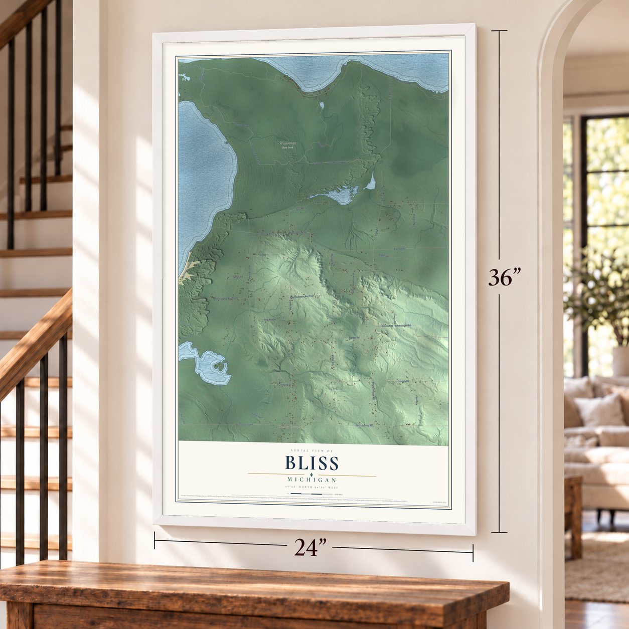 Bliss, Michigan map, 24 x 36 inch print in a white frame by a staircase