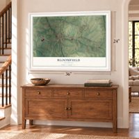 Bloomfield, Kentucky map, 24 x 36 inch print in a white frame above a dresser by a staircase