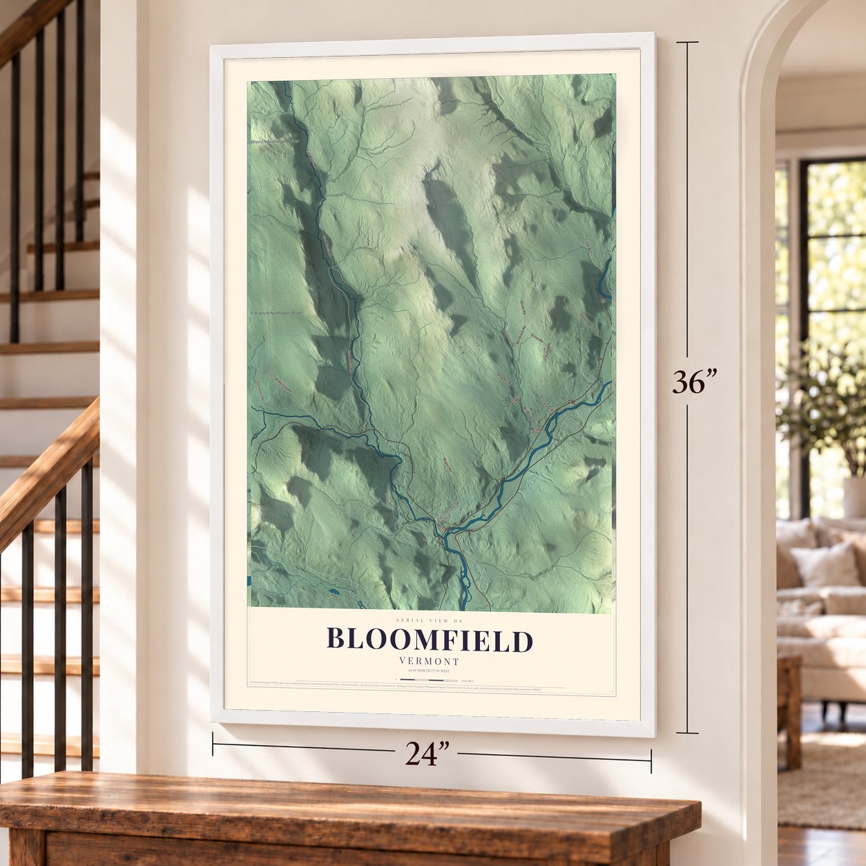 Bloomfield, Vermont map, 24 x 36 inch print in a white frame by a staircase