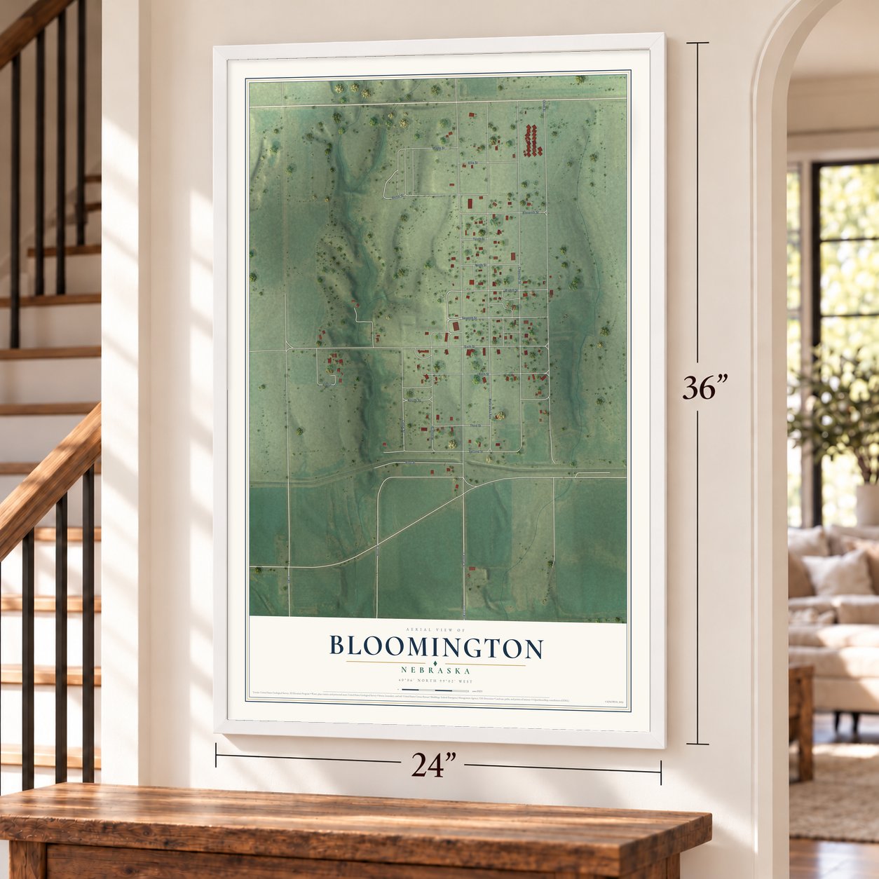 Bloomington, Nebraska map, 24 x 36 inch print in a white frame by a staircase
